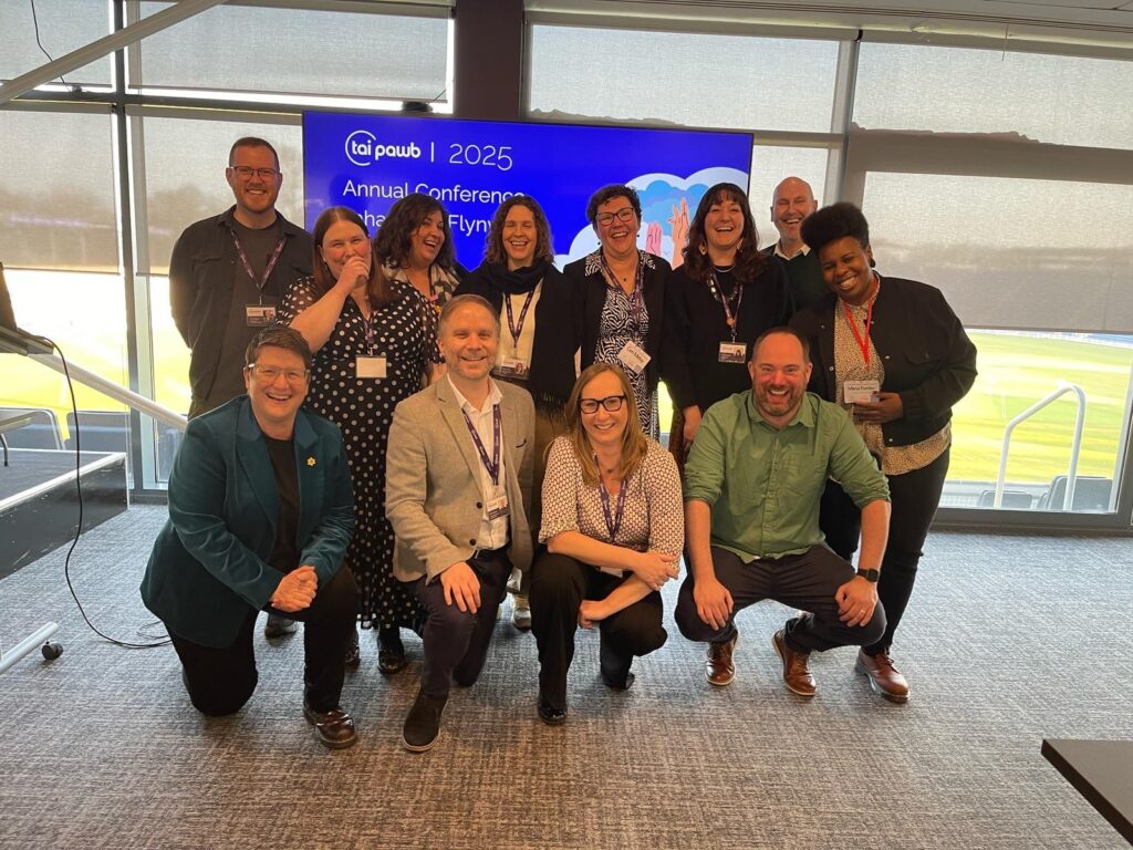 The Tai Pawb team in a group posing for camera at our last conference at Glamorgan cricket ground.